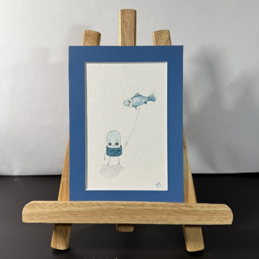 Jun Holding Blue Fish Balloon Painting
